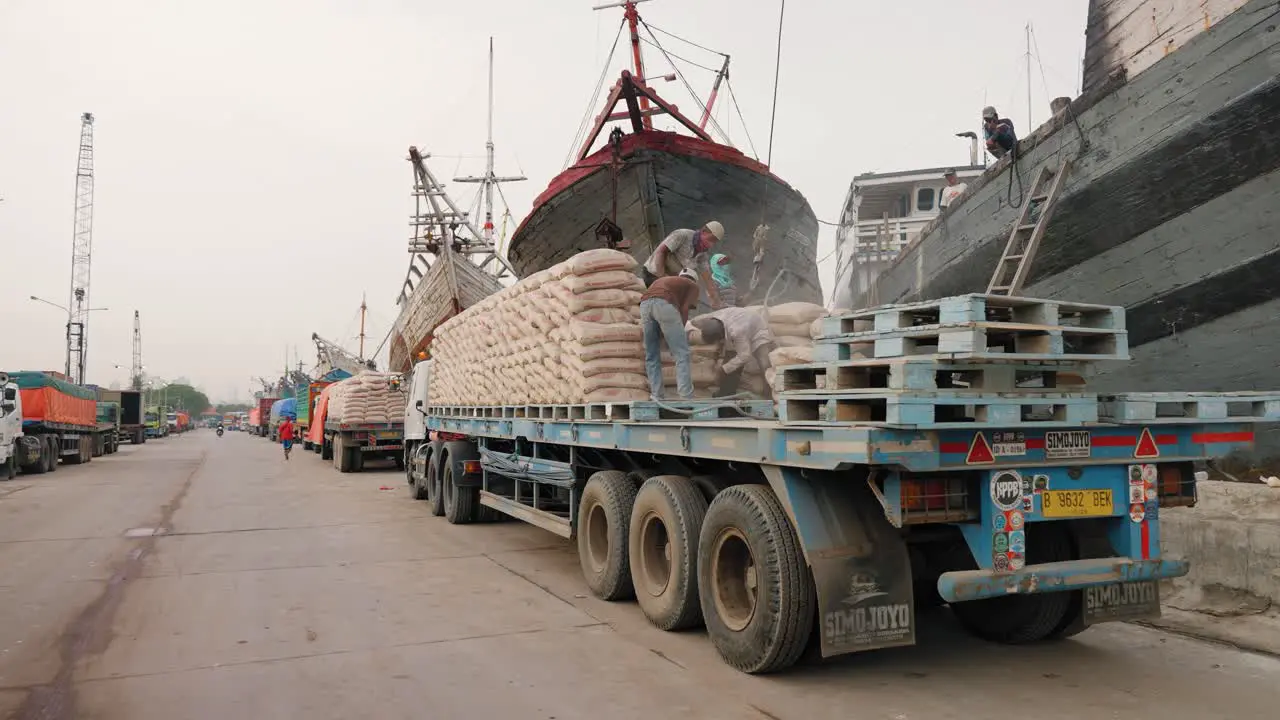 Tracking Shot of Men Loading Truck