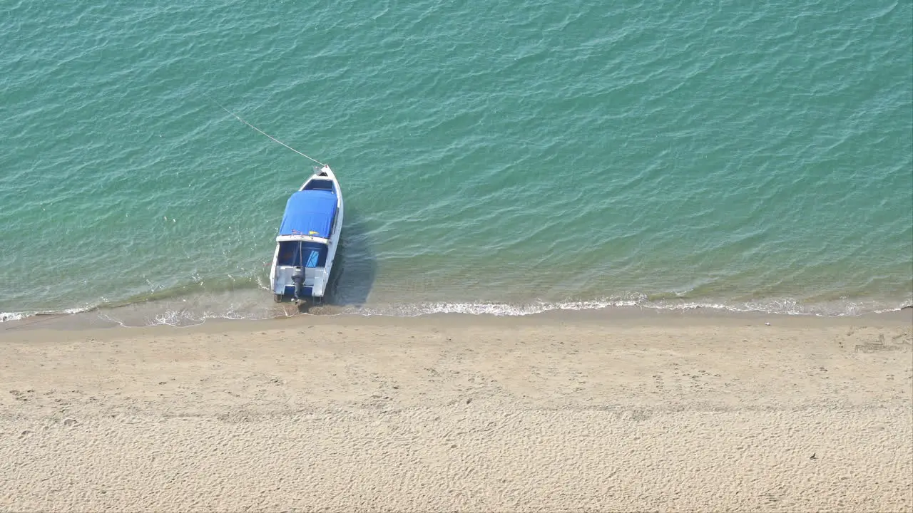 Anchored boat on sea near beach