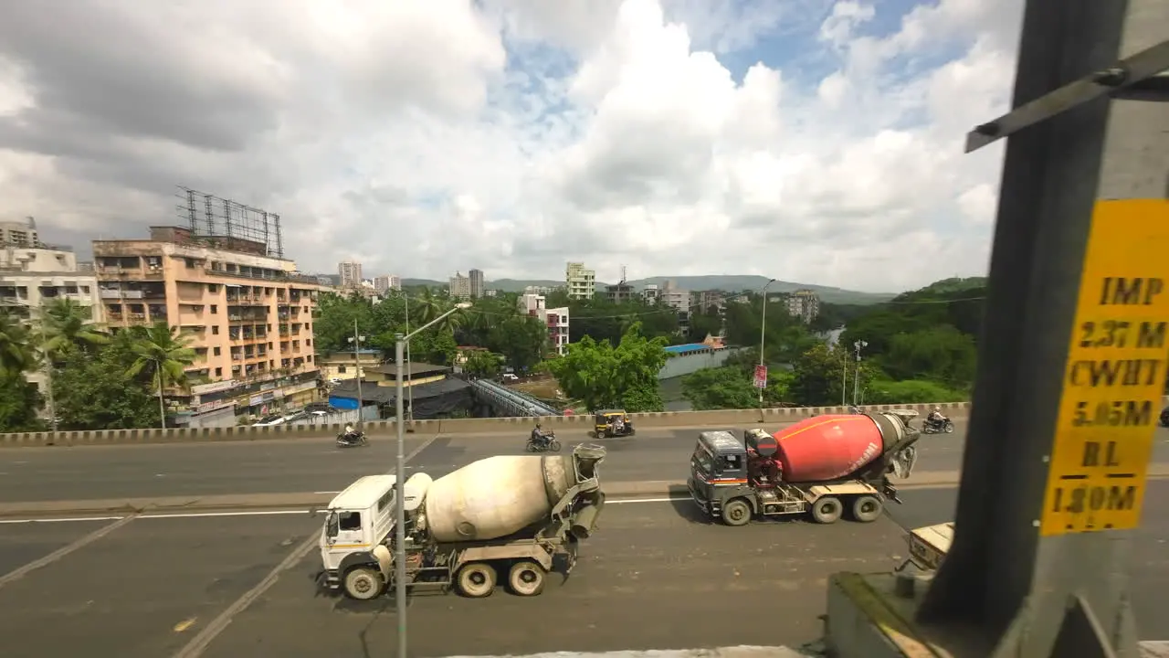 Beautiful weather with city view from metro train top birds eye view tracking shot India Mumbai Maharashtra