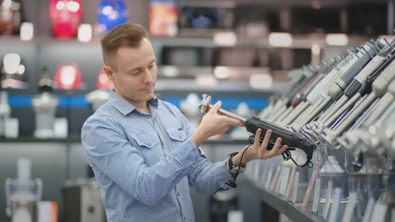 Electronics store a man holding a blender