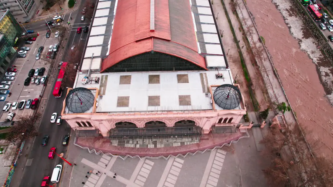 Bird's eye view of the Mapocho Station Cultural Center with people walking along its front and copper roof a heritage site in the city of Santiago Chile