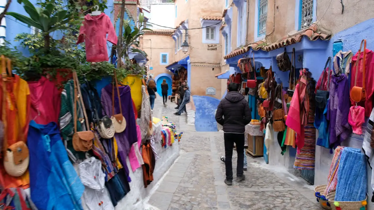 Walking POV in street market in Chefchaouen Morocco