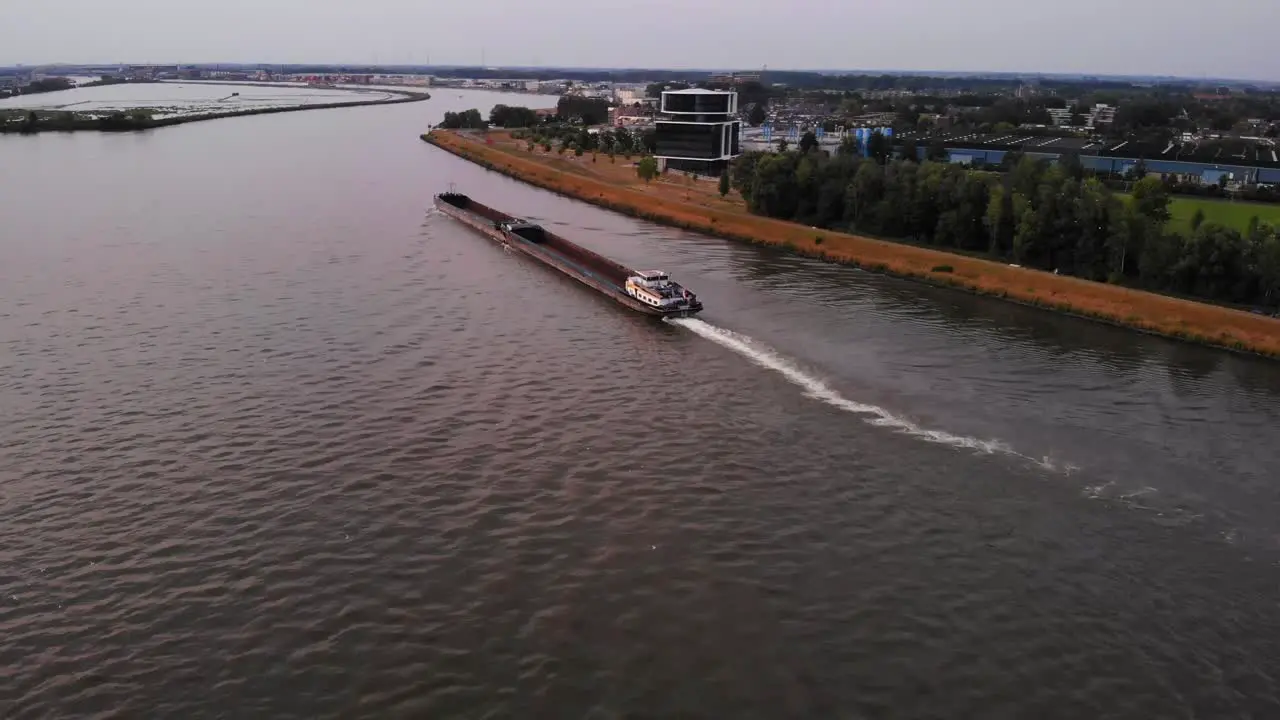 Pull Back Shot Of Large Candesso Cargo Ship Sailing In Noord River Alblasserdam south Holland