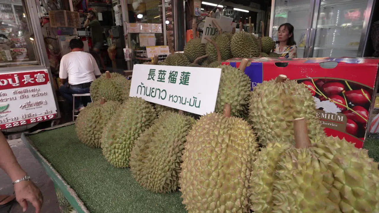 Durian on Display at Street Food Vendor in Chinatown Bangkok Thailand