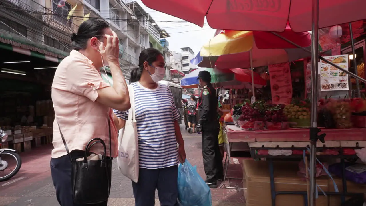 Police Inspecting Streets and Food Stalls in Chinatown in Bangkok Thailand