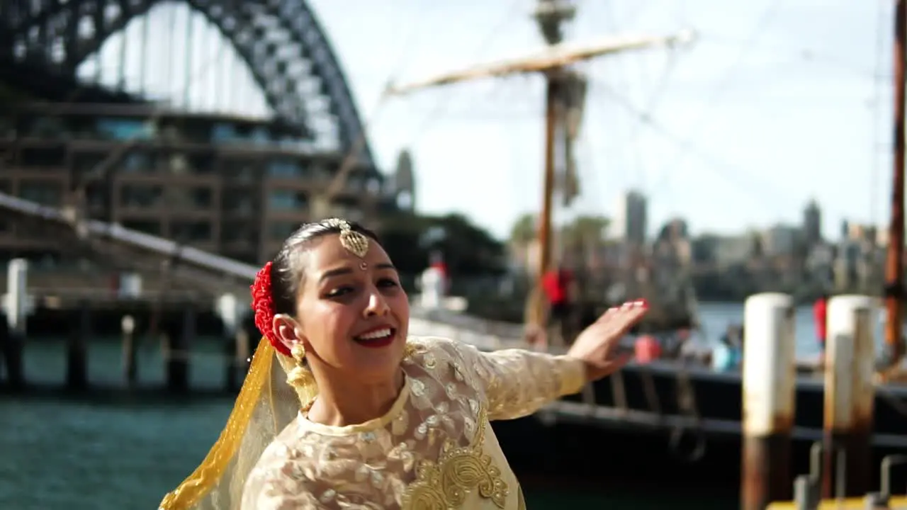 Woman Dancing Indian Classical Dance In Front Of Harbour Bridge In Sydney Australia slow motion