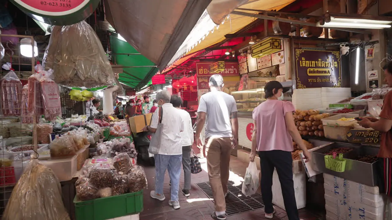 People Shopping at Traditional Chinese Wet Market in Chinatown in Bangkok Thailand