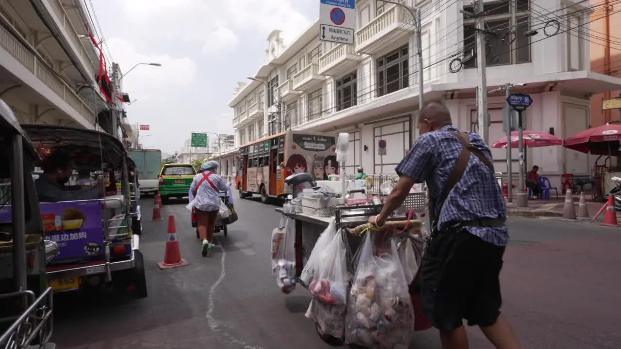 Street Vendors Walking on Street in Chinatown in Bangkok Thailand