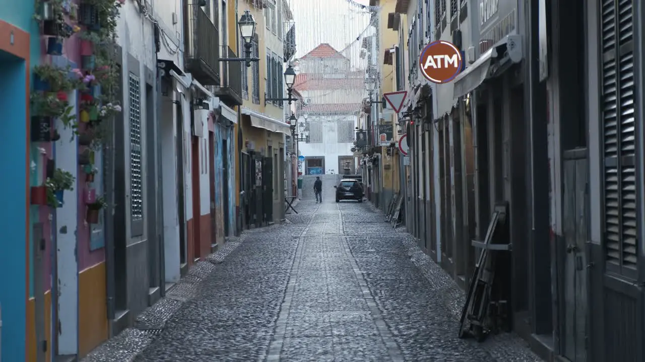 Still shot Picturesque Street Funchal old town Cars crossing Madeira