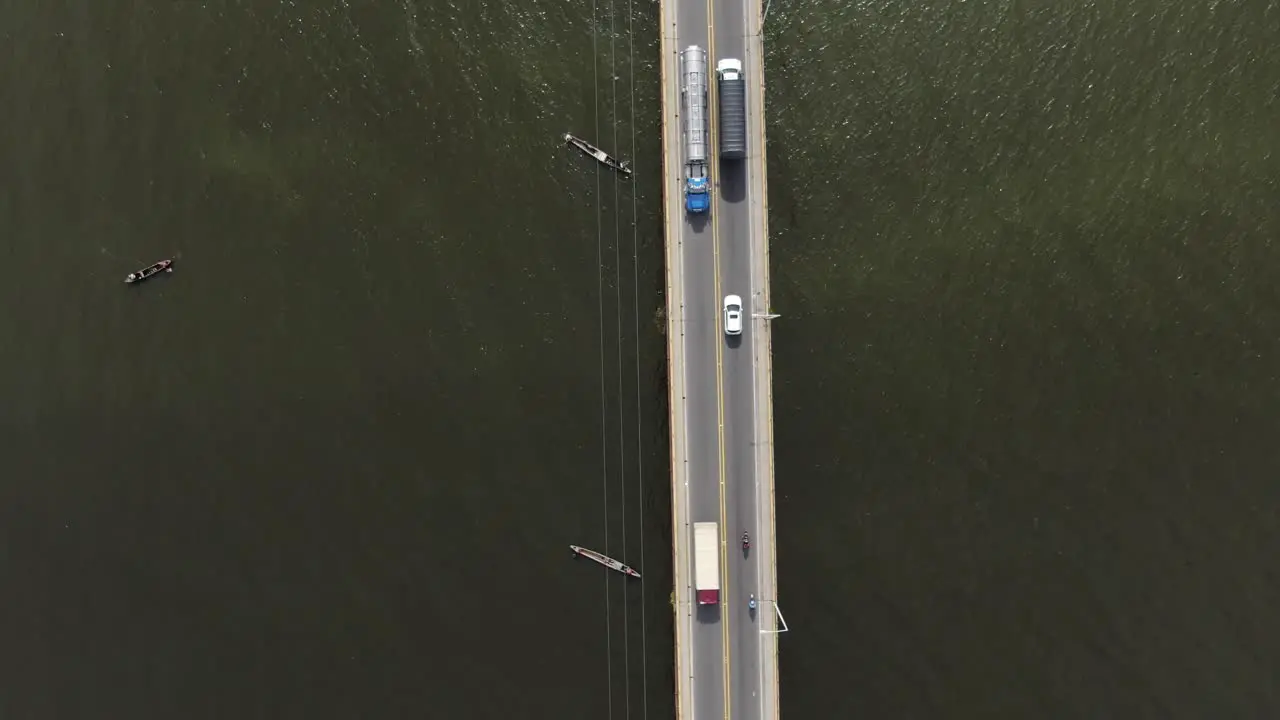 Fishing boats using nets under the highway bridge