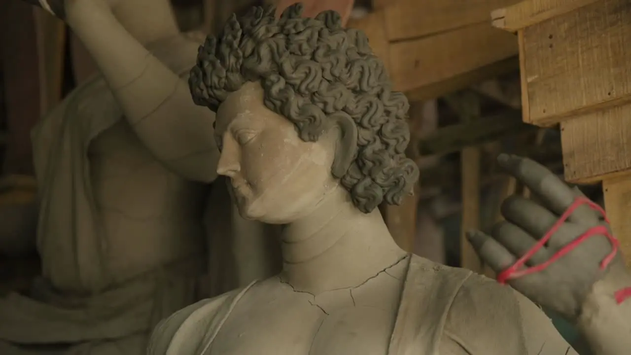 Unfinished clay Idols of Indian Gods and Goddesses being made at sculpture workshop