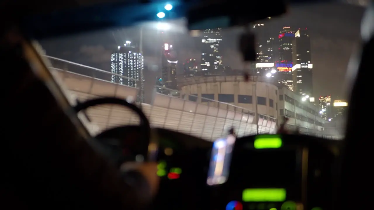 Illuminated skyscrapers in night Moscow view from the moving car