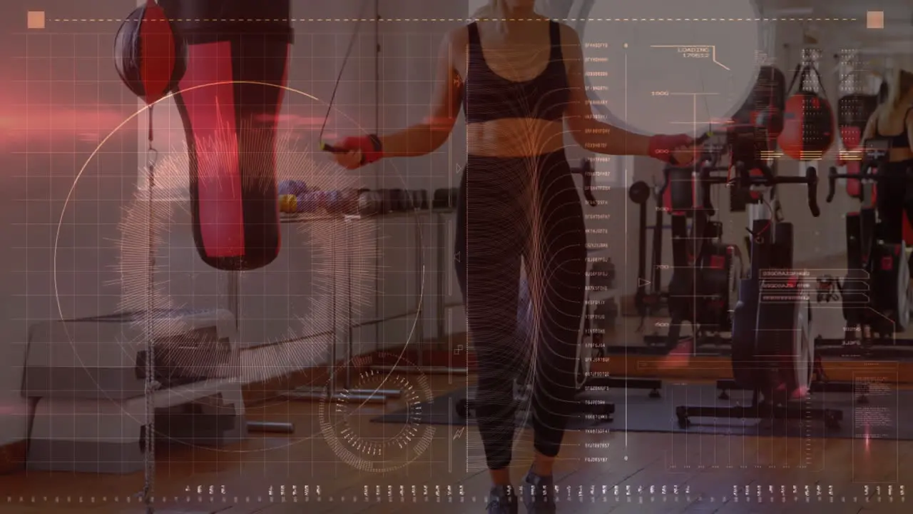 Digital interface with data processing against caucasian female boxer jumping ropes at the gym