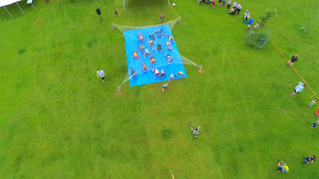 Drone shot of athletes at a Mud Run starting line