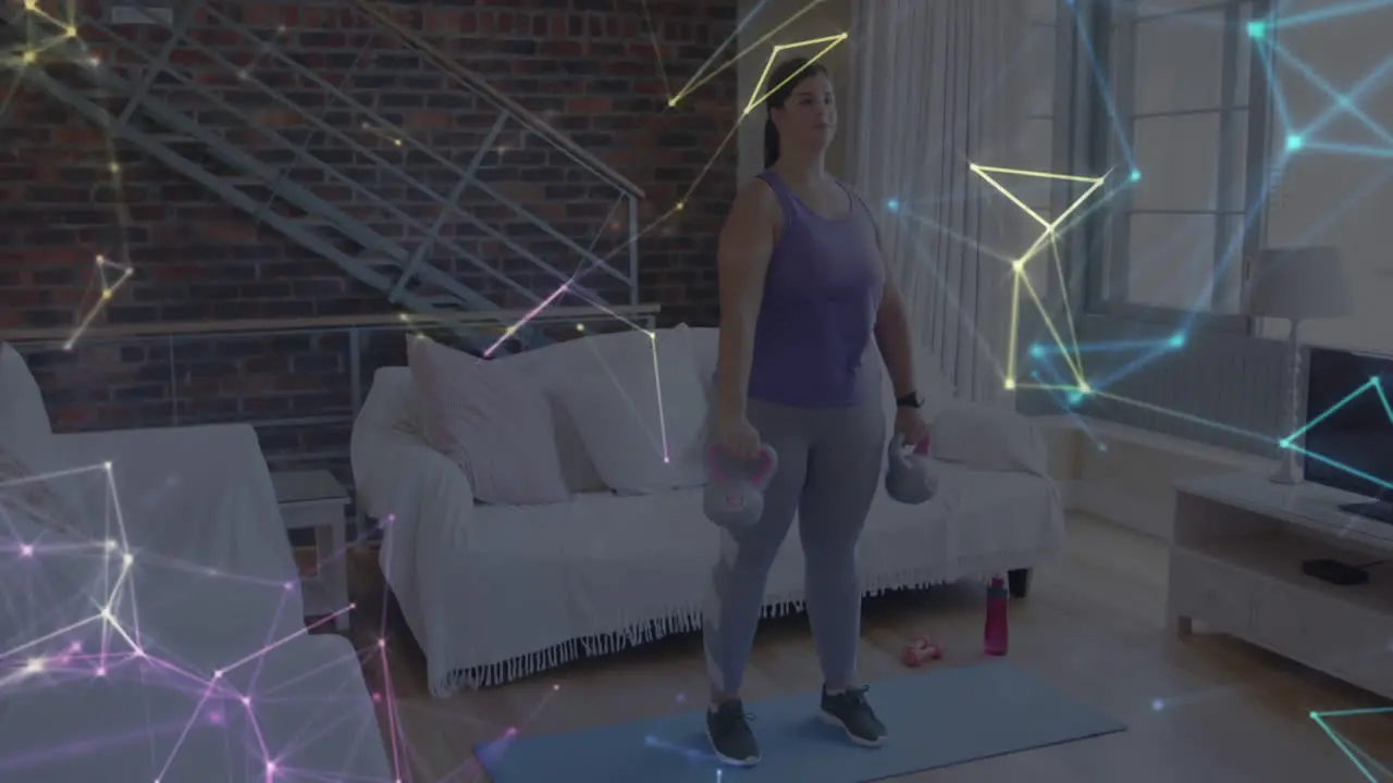 Animation of network of connections over woman lifting kettlebells exercising at home