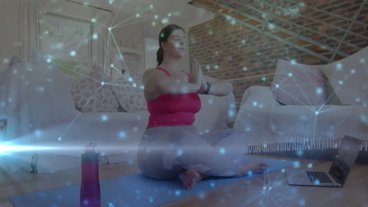 Animation of network of connections over woman meditating exercising at home