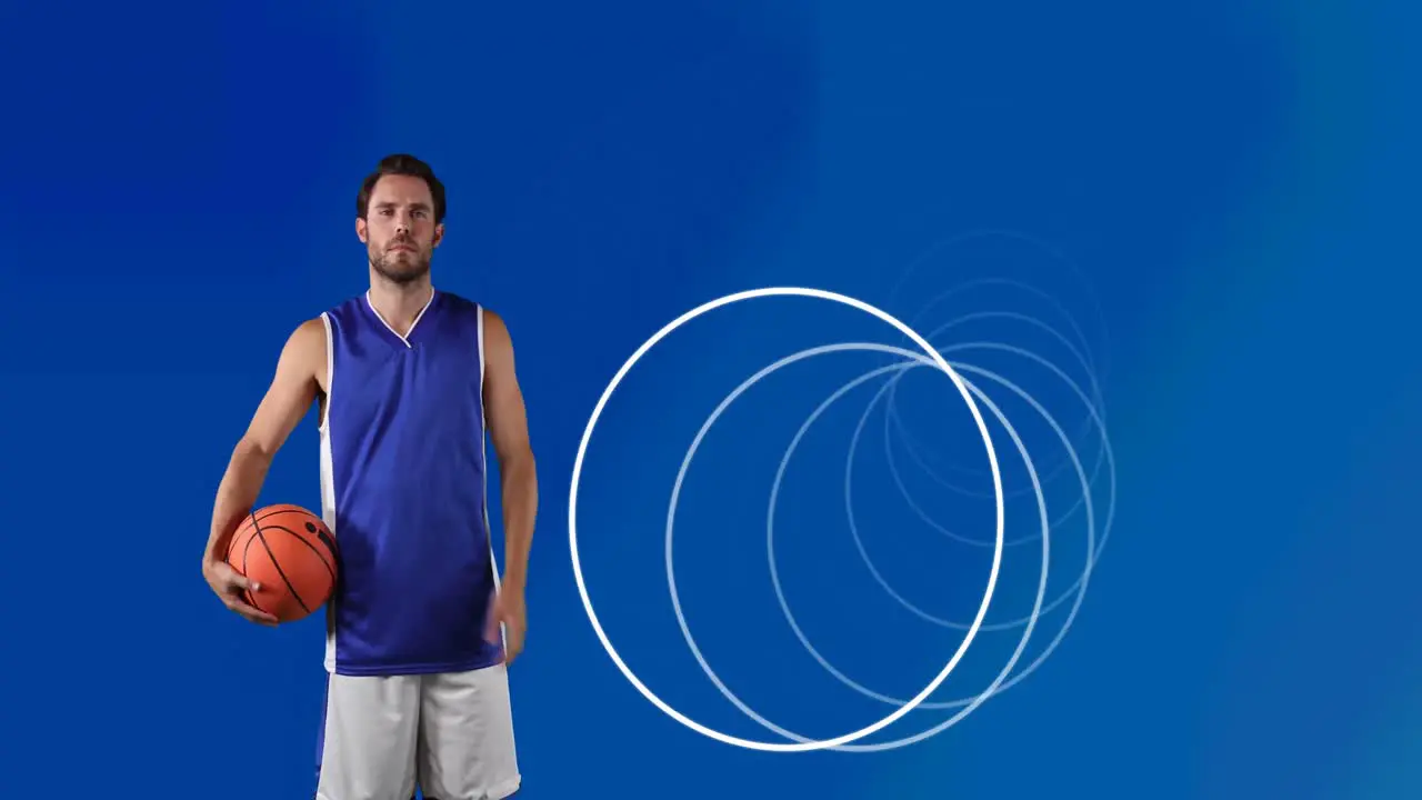 Animation of circles over male basketball player holding ball