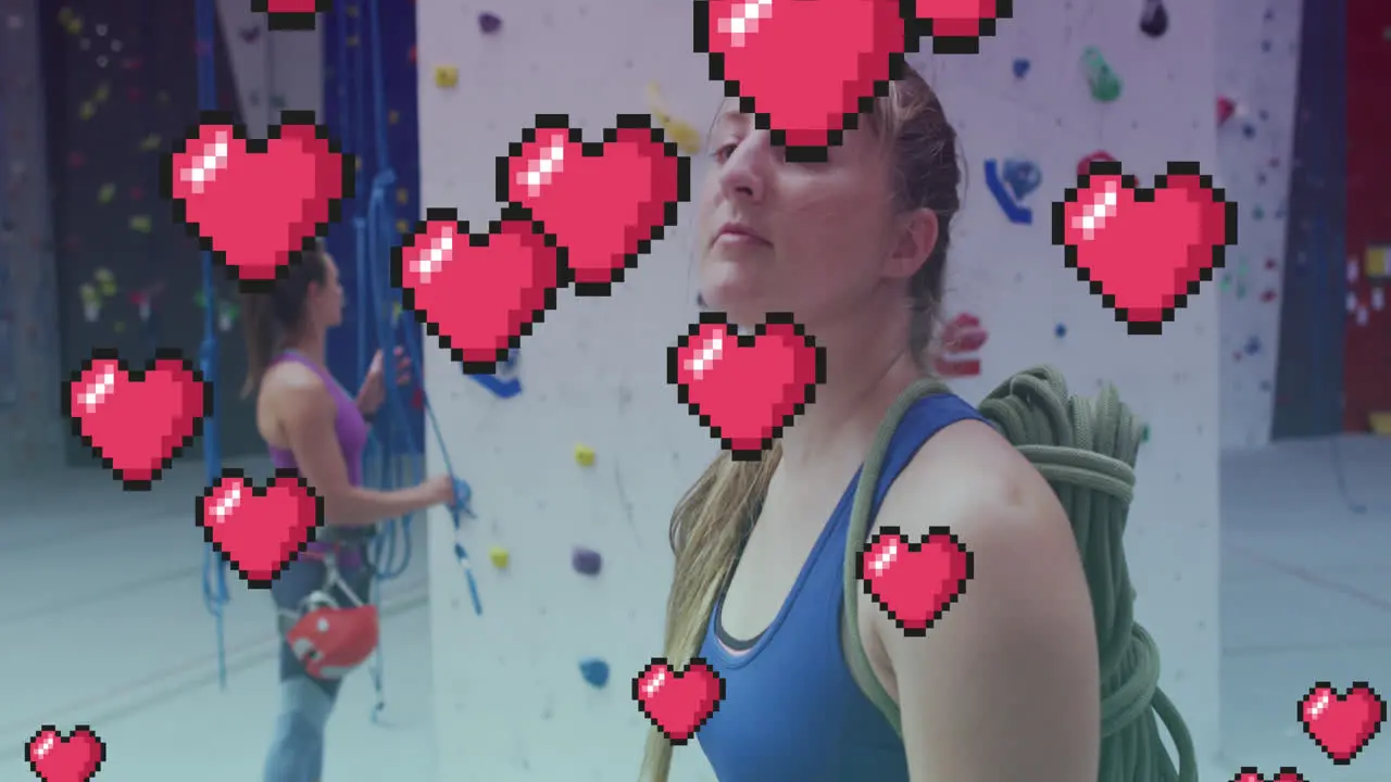 Multiple pink heart icons floating against portrait of caucasian fit woman at the gym