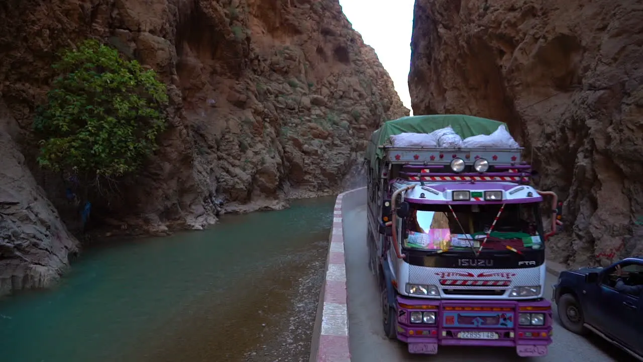 A truck travels on a dangerous winding road through the Atlas Mountains in Morocco