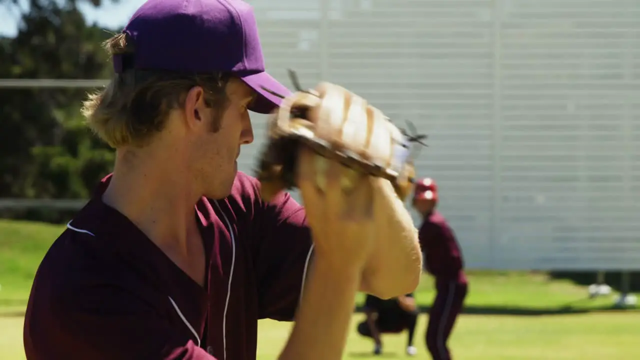 Baseball players pitching ball during practice session