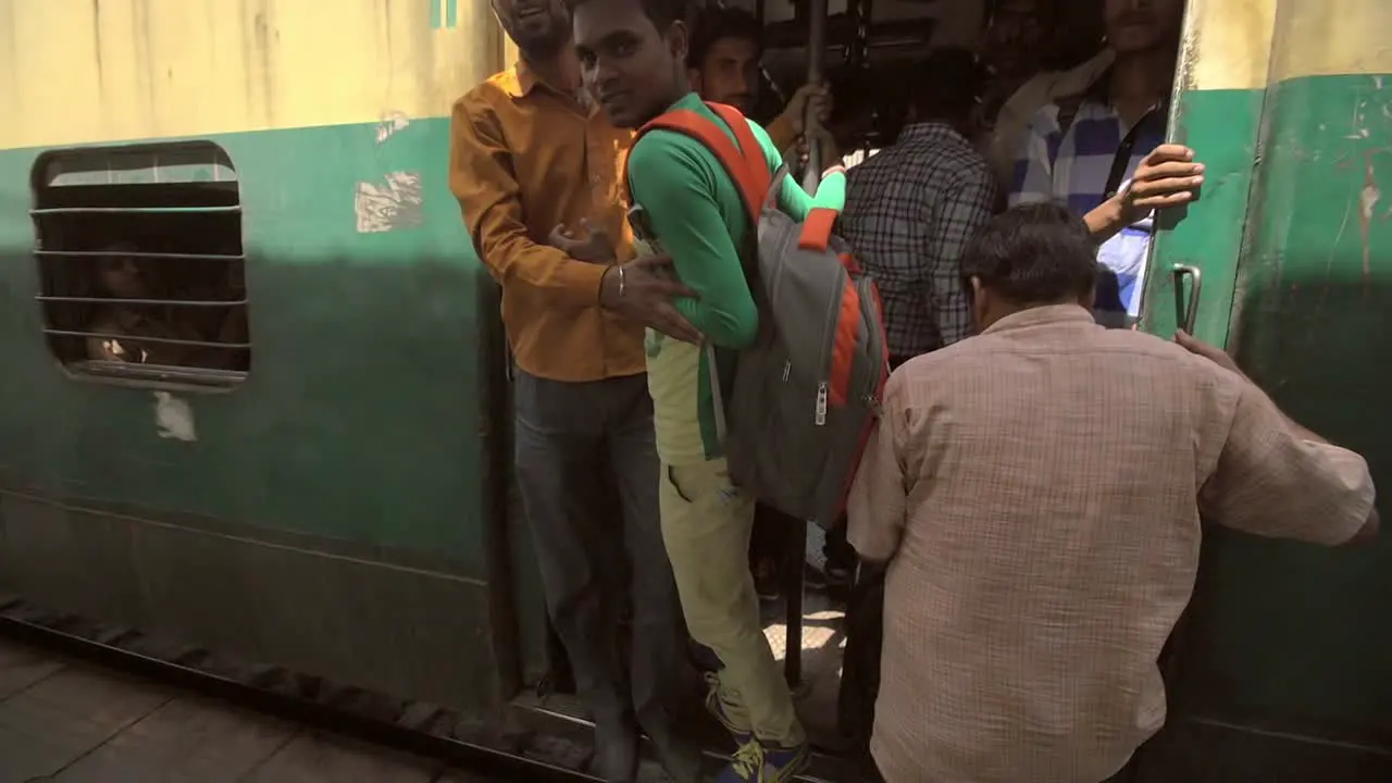 Passengers Boarding a Crowded Train in India