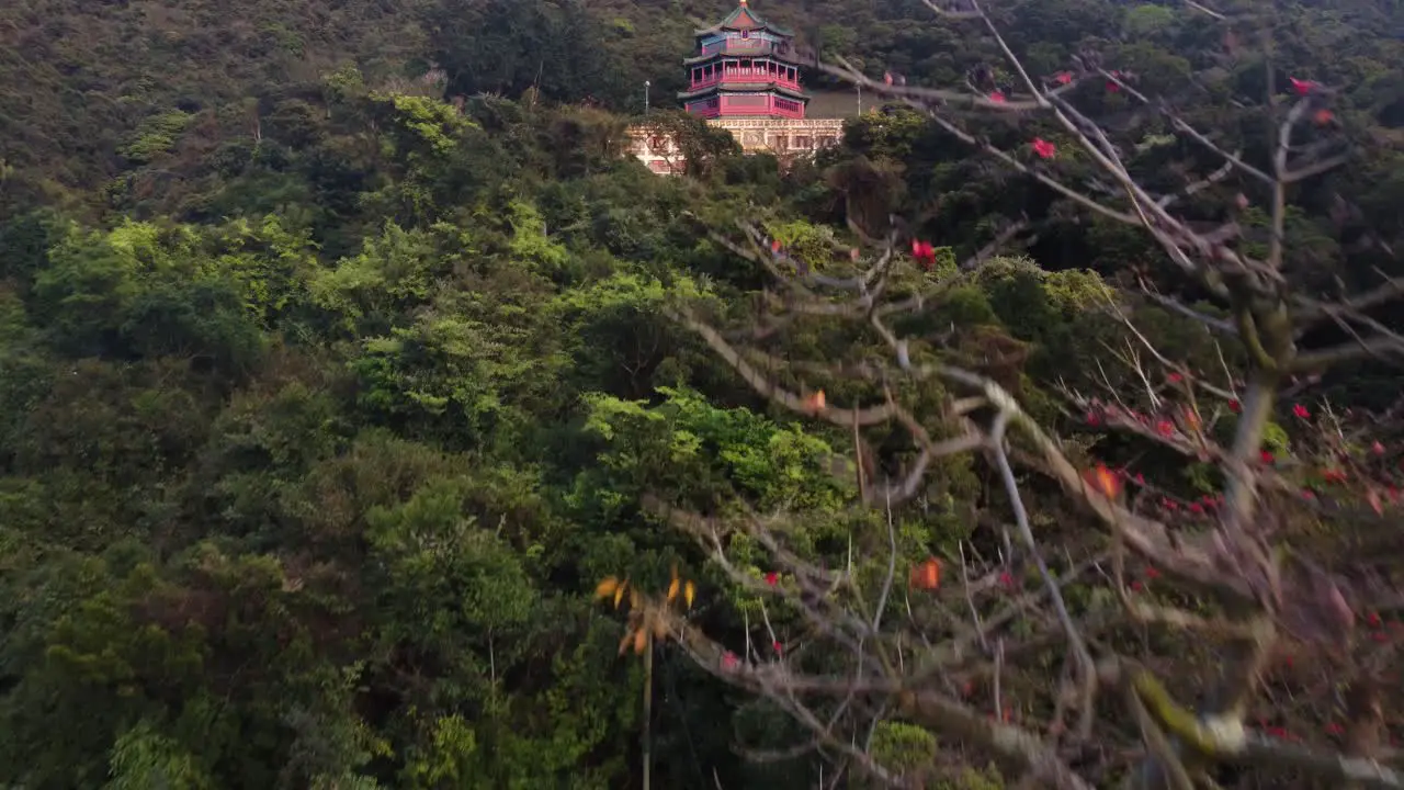 Forward Climbing Drone Reveal of a Red Temple in Hong Kong