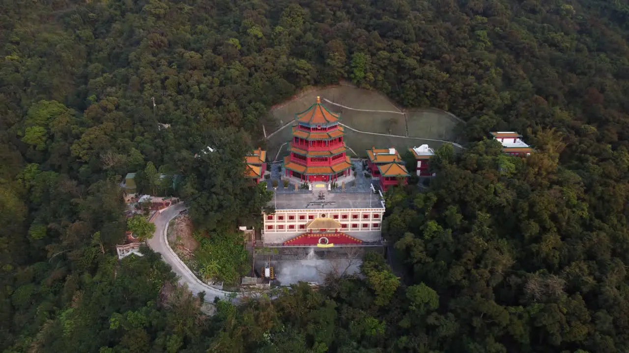 Backwards Drone Shot of a Red Temple In Hong Kong