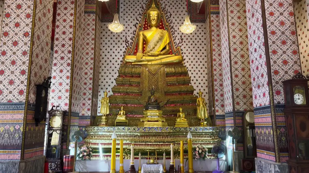 Reveal of a big golden Buddha Statue in a Buddhist temple in Thailand