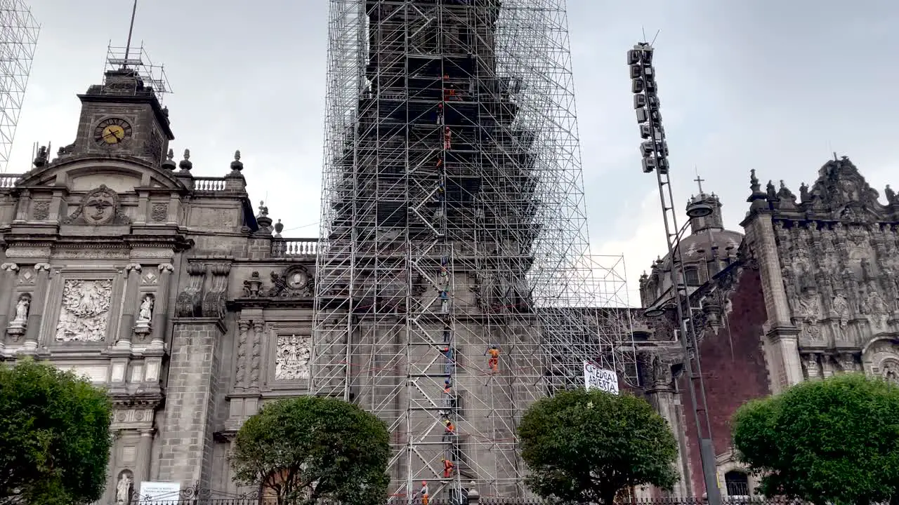 shot of masons during the renovation works of the cathedral of Mexico city