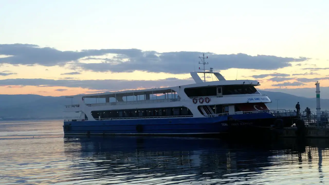 Ferry And People Approaching The Ship Pier