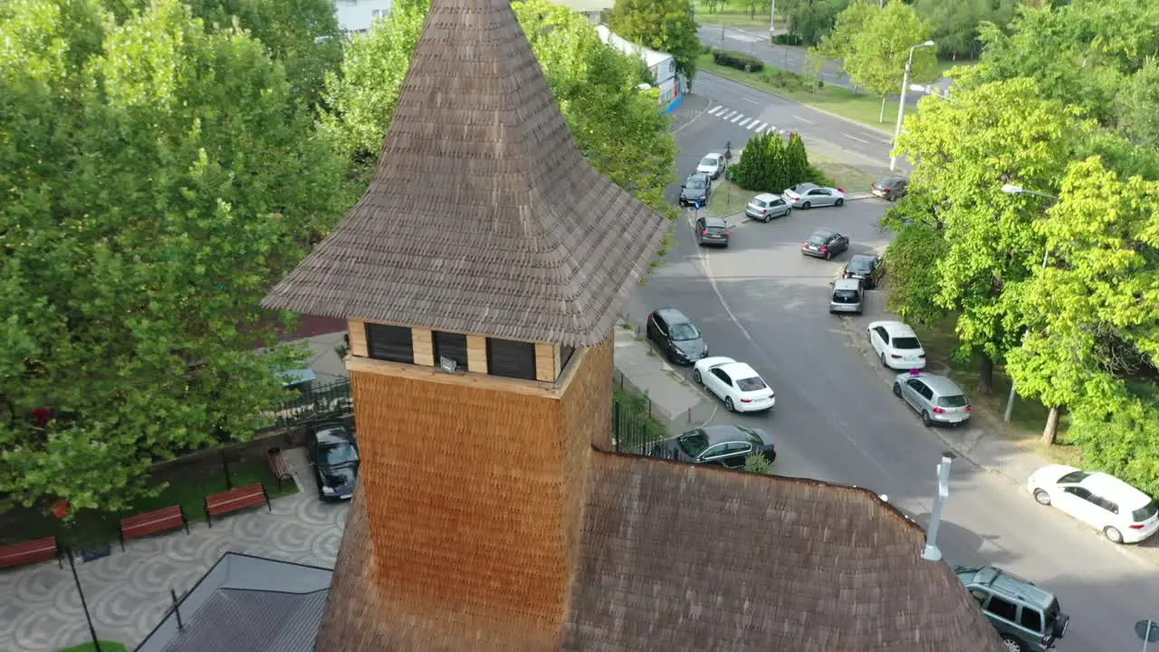 Circle drone shot of beautiful wooden orthodox church in Bucharest Romania