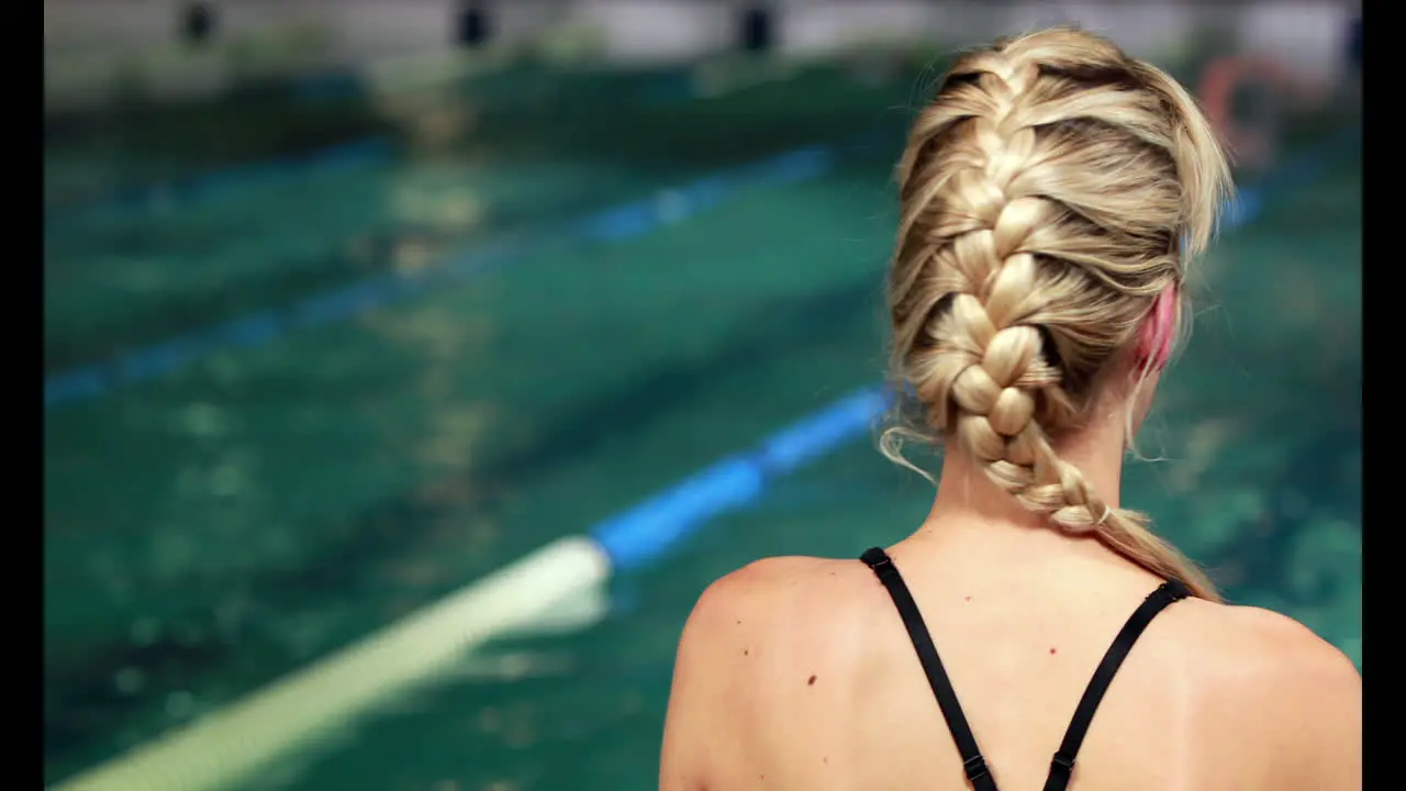 Fit blonde in the swimming pool