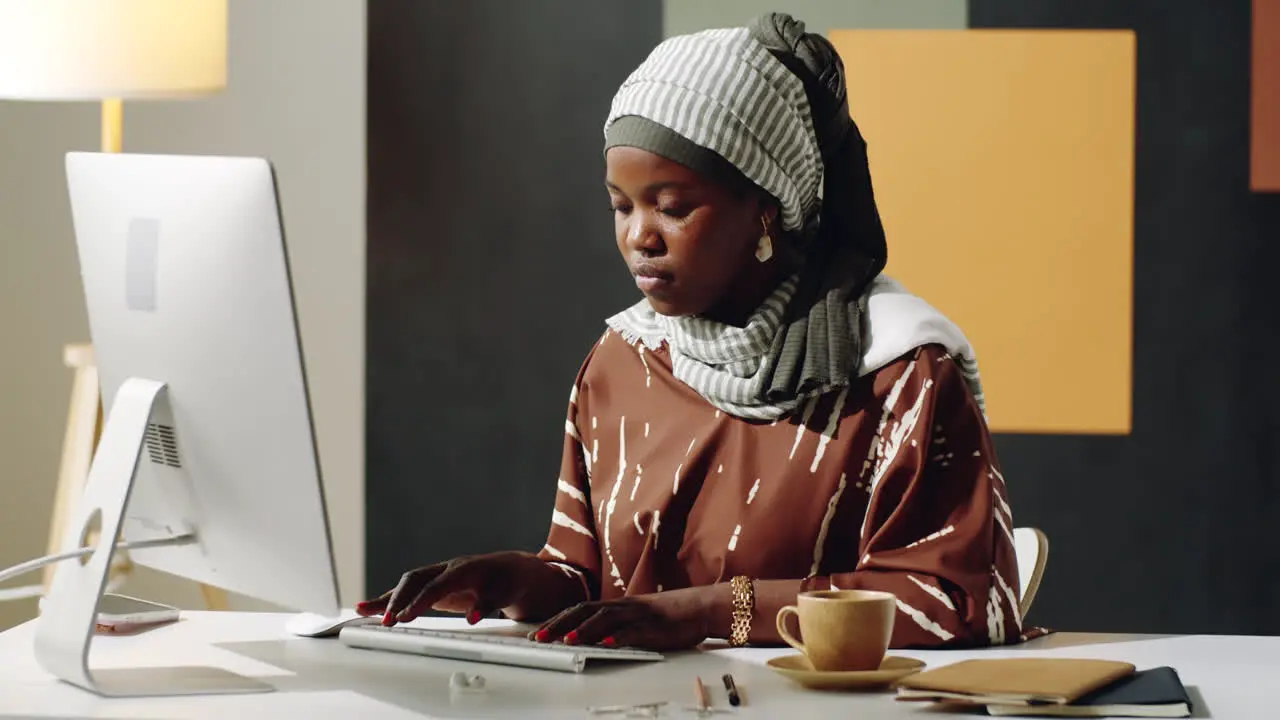 Young Black Woman Using Computer