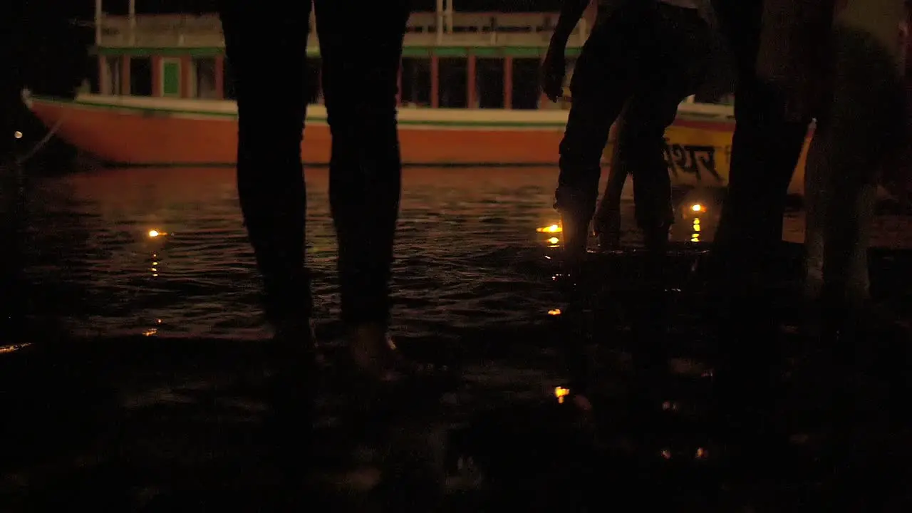 Men and Women Standing in Ganges at Ceremony