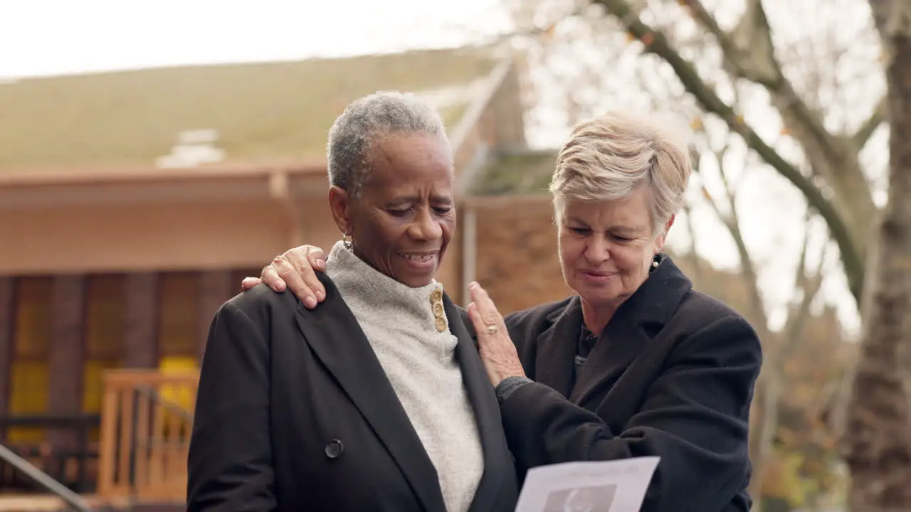 Funeral sad and senior women by church hug