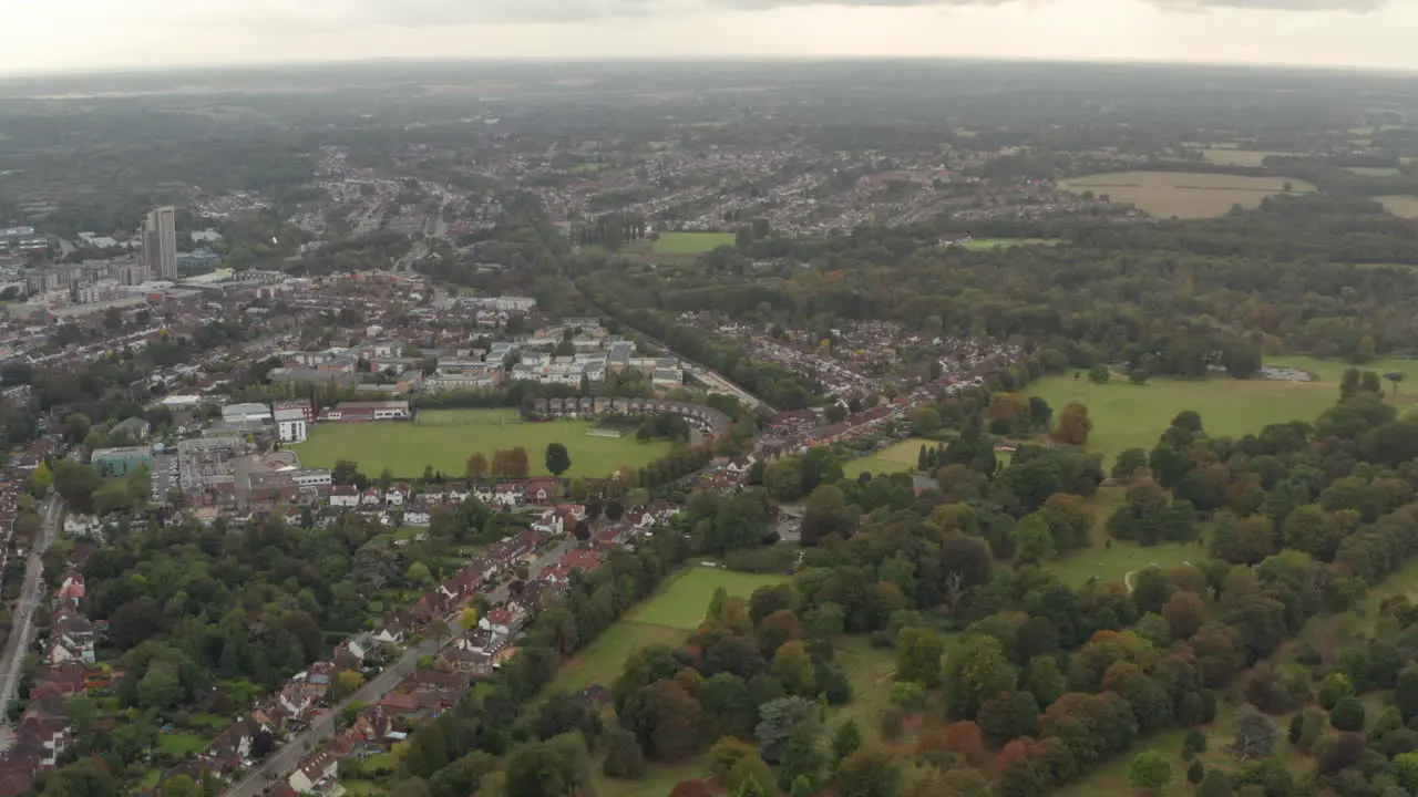 Aerial shot over Cassiobury park and Watford underground station