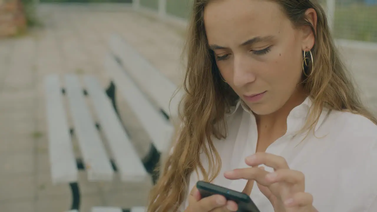 Thoughtful Woman Browsing Smartphone