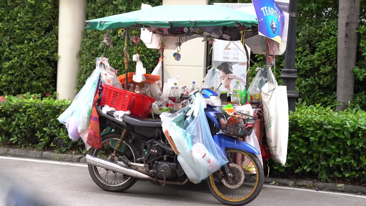 Static shot of a drinks stall mounted on a motorcycle in southest Asia