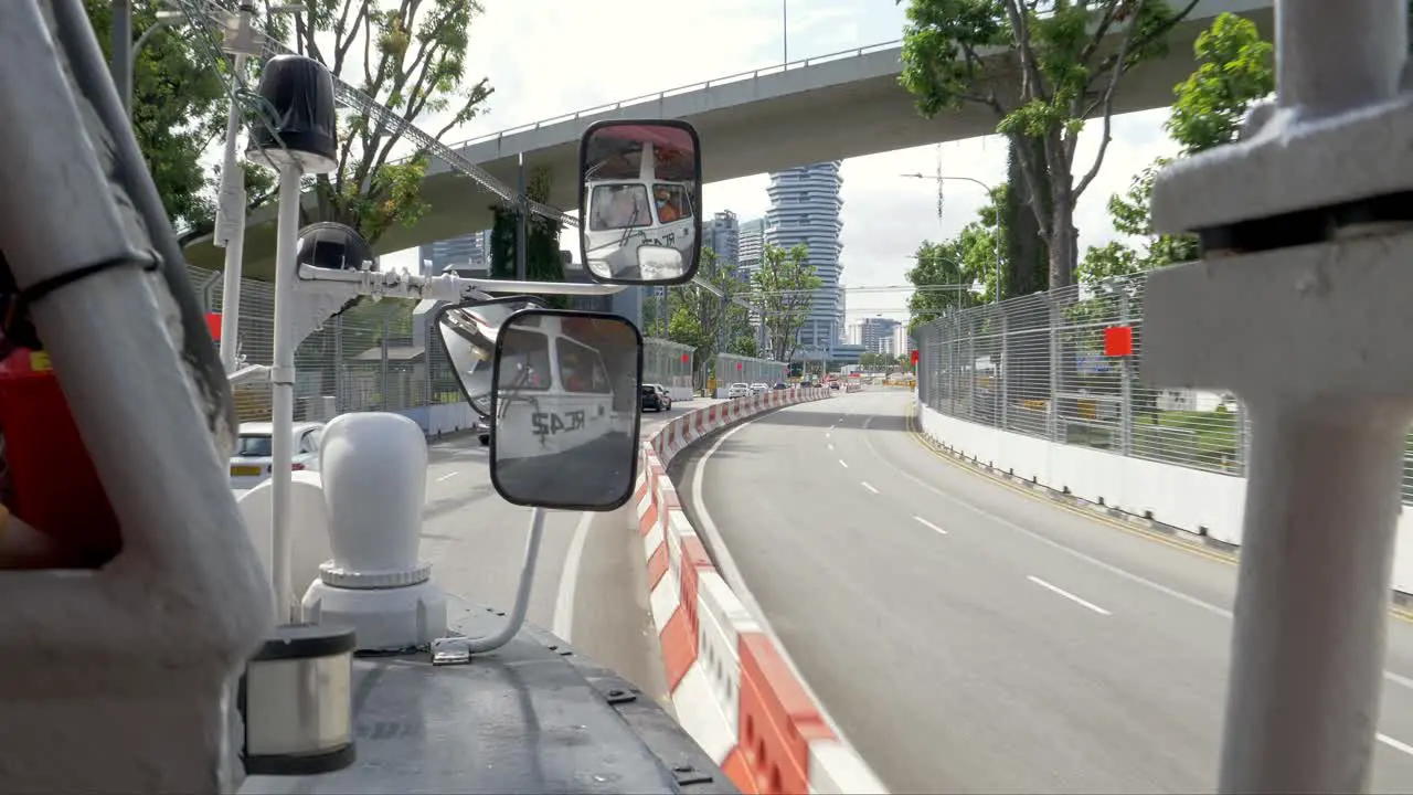 View through the window of an amphibious vehicle during a city tour of Singapore