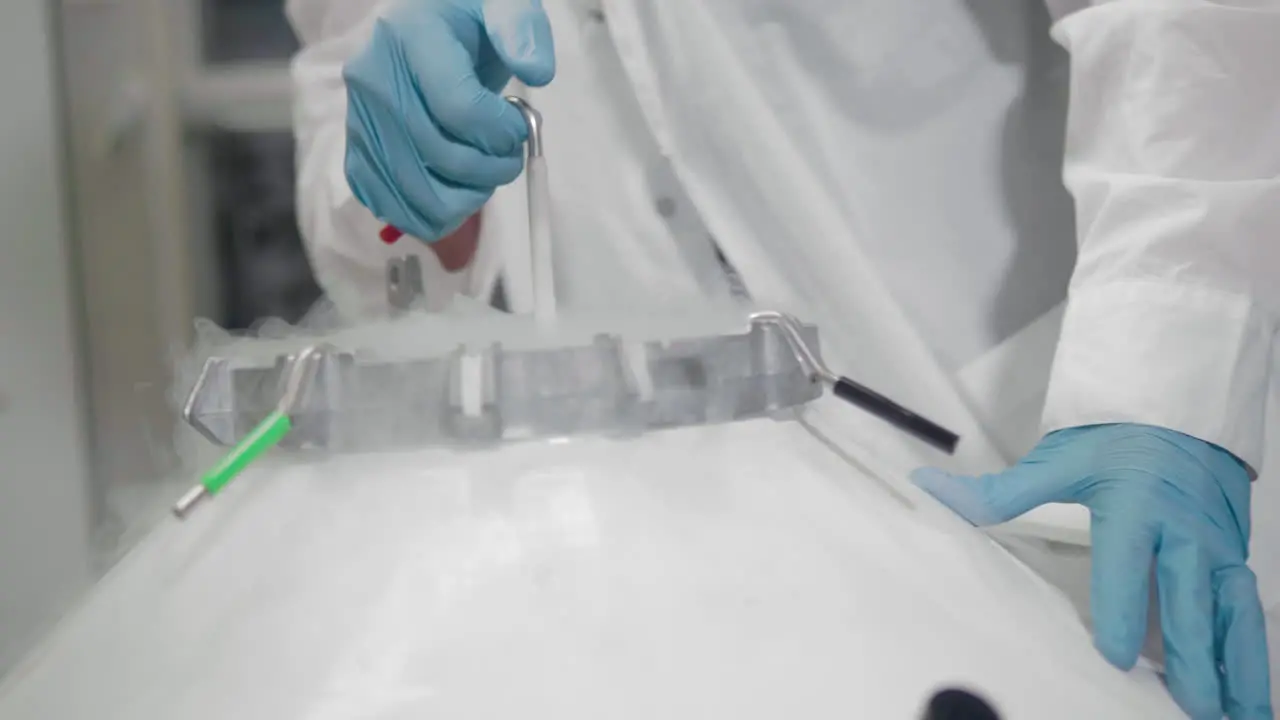 Scientist removing the container from the stem cell Bank frozen stem cells