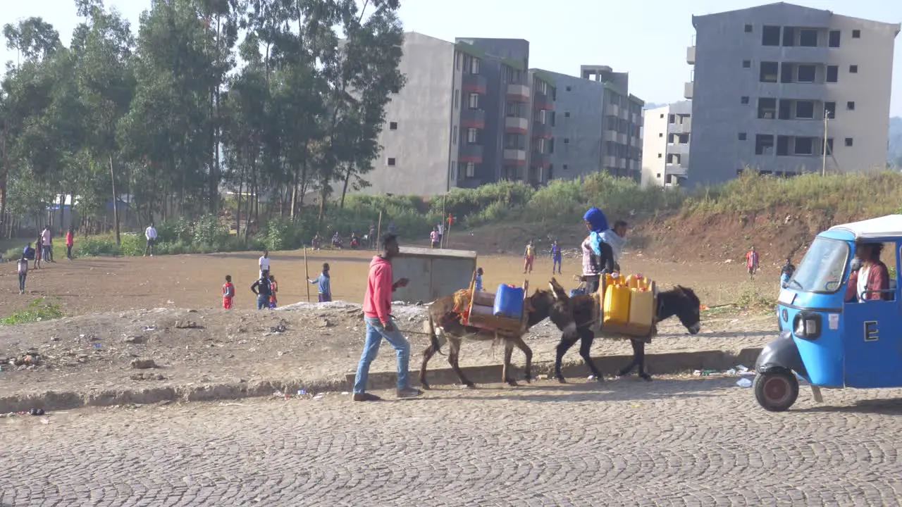 Africa morning playing football bring water and start transport all in one shot