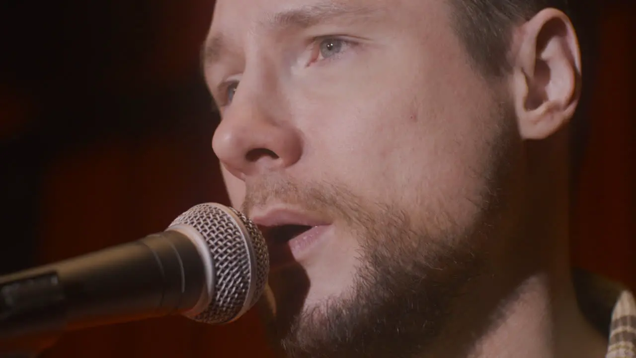 Close Up Of Man Singing During A Live Music Performance 1