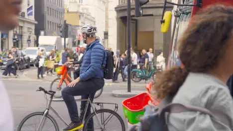 Wide Shot of Cyclist In Busy London Street