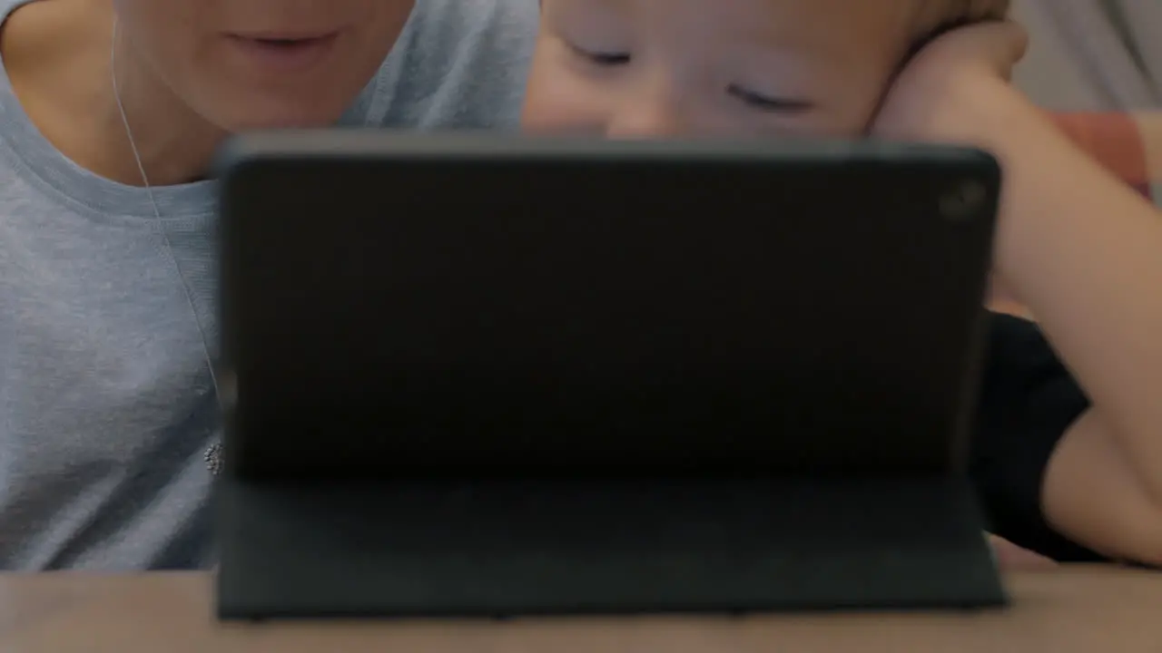 Mom and son playing with tablet computer