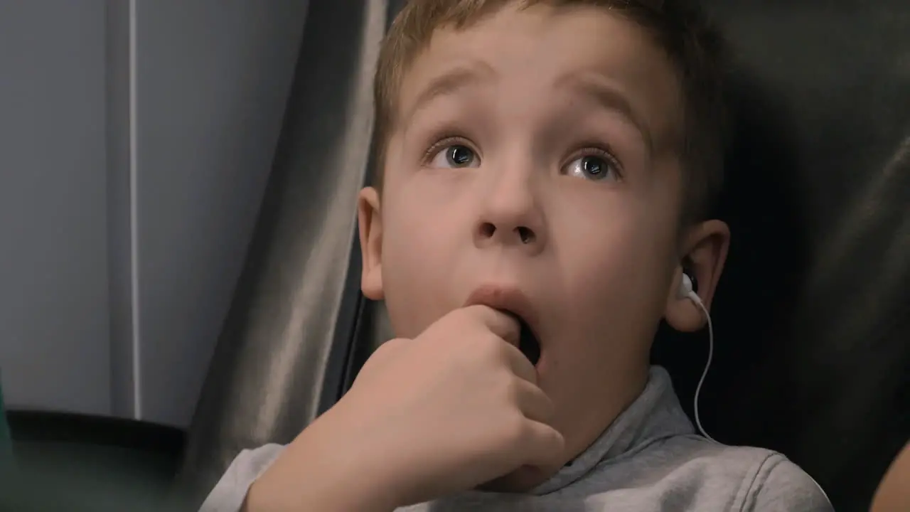 Child watching cartoons during train travel