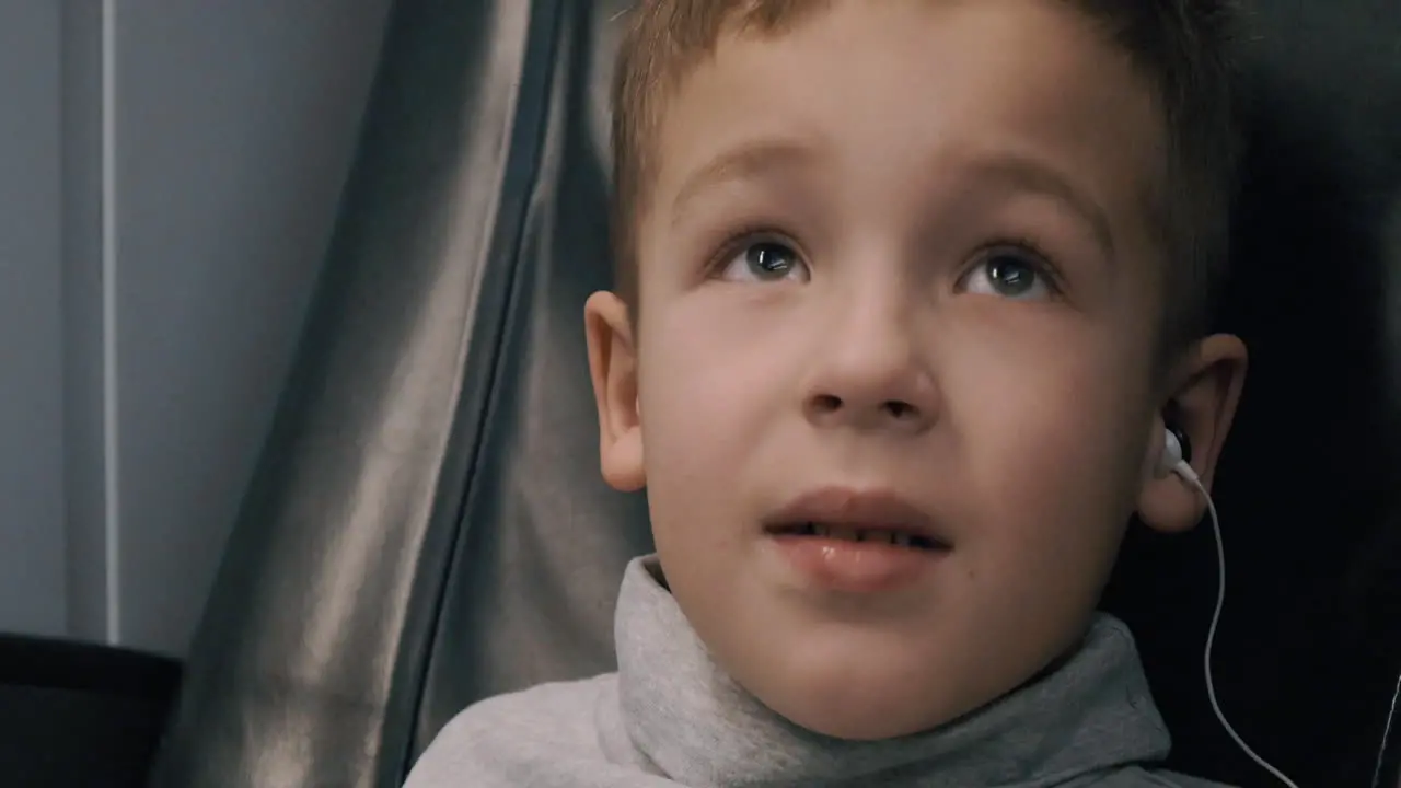 Child watching TV during train journey