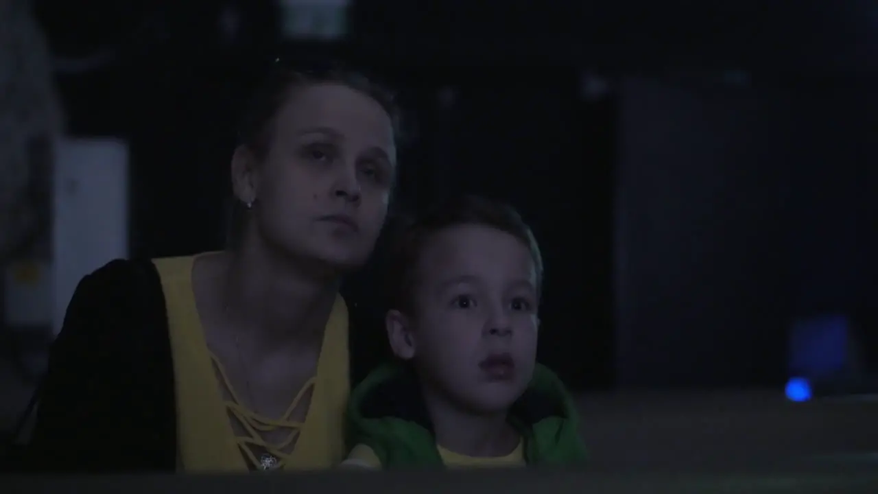 Mom and kid at the cinema