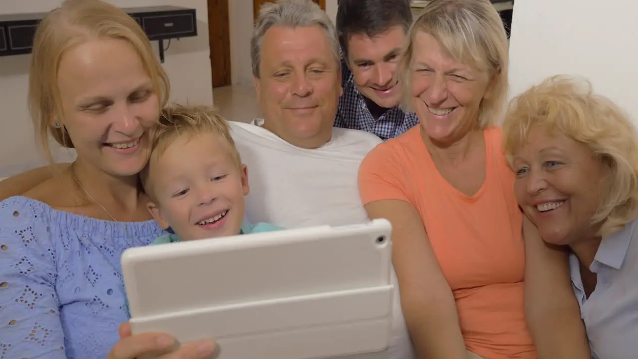 Big family watching something on touch pad