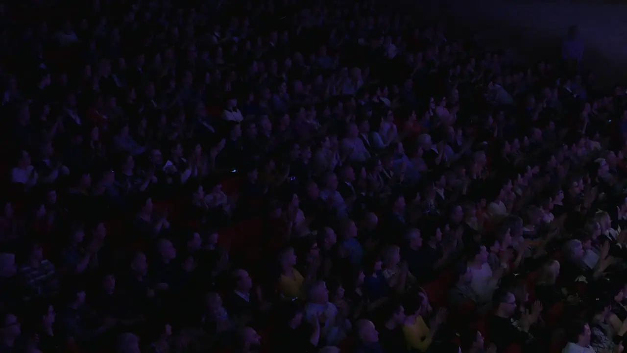 People applaud in the movie theater