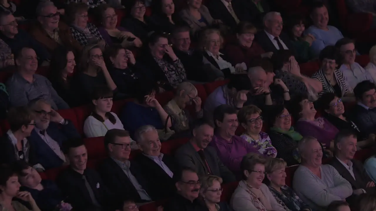 Audience watching performance and laughing